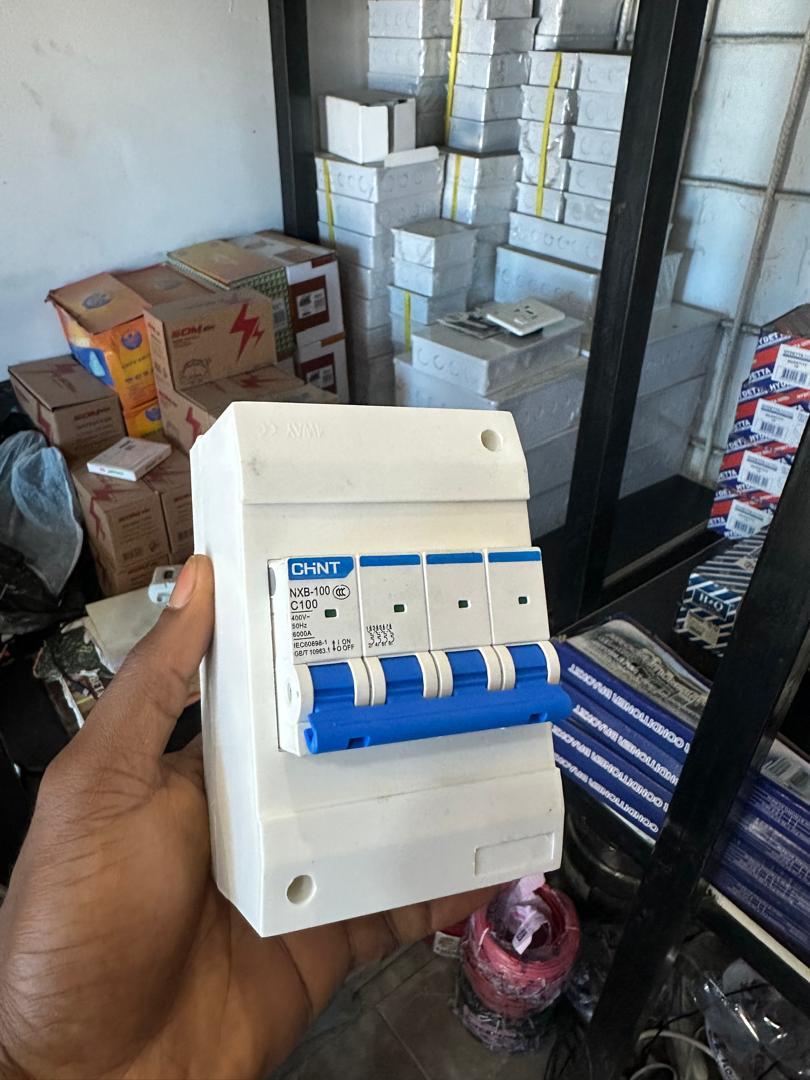 CHINT NXB-100 C100 four-pole circuit breaker in an enclosure